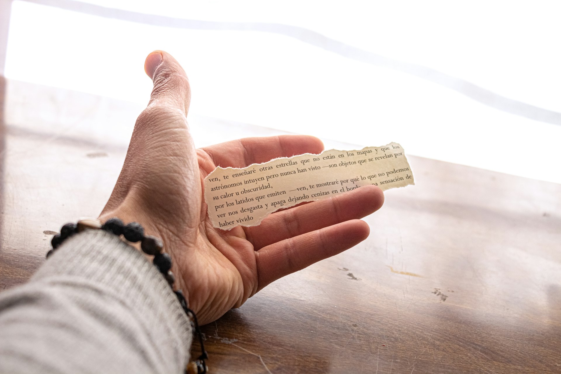 person holding white printer paper